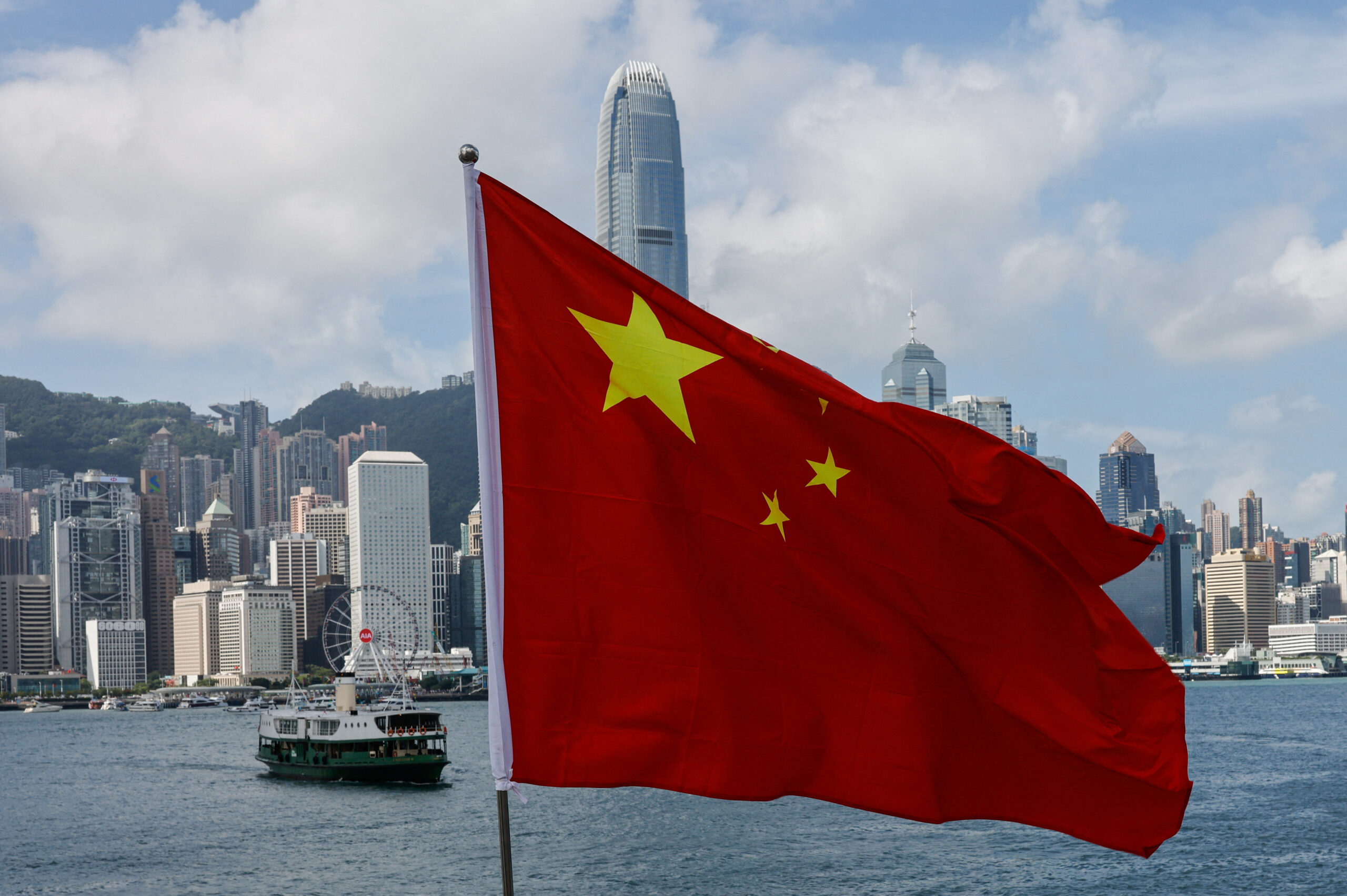 the chinese national flag is seen in front of the financial district central on the chinese national day in hong kong